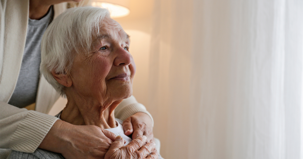 A patient poses with a family member, deciding whether to choose palliative or hospice care
